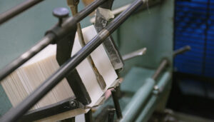 Stack of Blanks Held In High Speed Press Before They Are Hit
